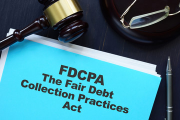 Business photo shows hand written text The Fair Debt Collection Practices Act (FDCPA)