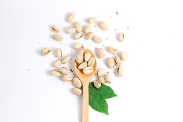 Pistachios in a wooden spoon. Top view