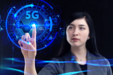 Business, Technology, Internet and network concept. Young businessman working on a virtual screen of the future and sees the inscription: 5G