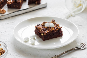 Chocolate brownie cake with marshmallows and nuts