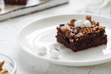 Chocolate brownie cake with marshmallows and nuts