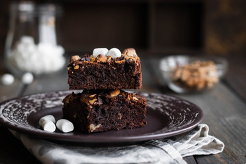 Chocolate brownie cake with marshmallows and nuts