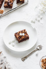 Chocolate brownie cake with marshmallows and nuts