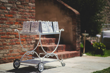 Old vintage cart with bon bons for guests at wedding in Italy