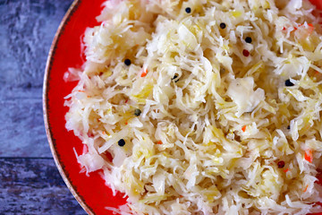 Plate with sauerkraut. Fermented foods. Probiotics Homemade fermentation of cabbage.