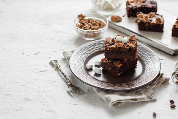 Chocolate brownie cake with marshmallows and nuts