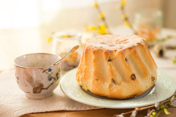 Polish Easter babka yeast cake. Glazing traditional baba raisin bread.