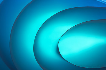 Macro photo. Abstract minimalistic background - paper art. Neon blue light, minimalism, copyspace. Waves, paper cut. 3D effect.