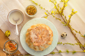 Polish Easter babka yeast cake. Glazing traditional baba raisin bread.