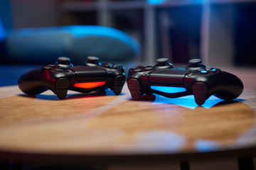 Game controller, videogame joystick or gamepad on a table. Close up studio shot