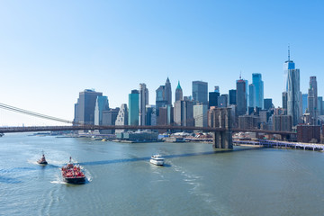 The Brooklyn Bridge and the Lower Manhattan New York City Skyline along the East River with Boats