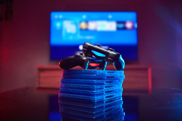 Game controller, videogame joystick or gamepad on a table. Close up studio shot