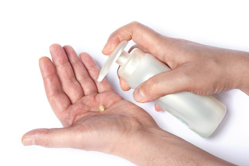 man washes his hands with soap to protect himself from the corona virus (COVIT-19) and bacteria, washing his hands with soap on a white background.