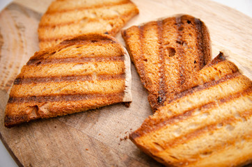 
toasted toasts on a wooden board