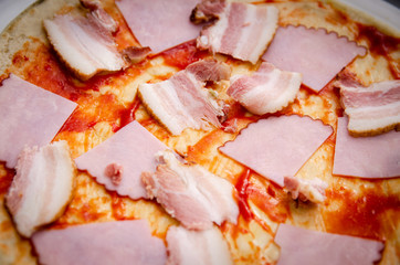 
pizza with ham and bacon
