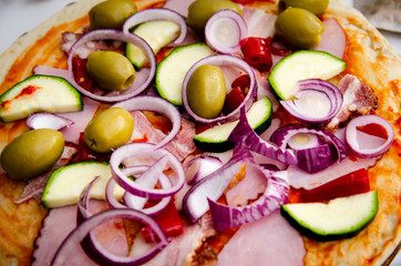 
homemade pizza with onions and olives