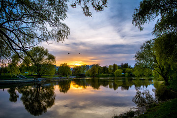 beautiful sunset in a city park with a river