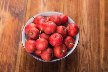 Red Hawthorn Berries on wooden table.