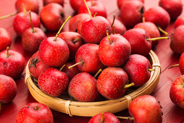 Red Hawthorn Berries on wooden table.