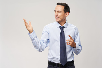young businessman showing thumbs up