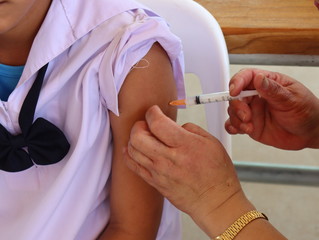 The nurse is vaccinating the students.
