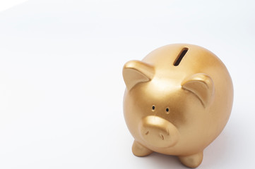 Gold piggy bank on white background. Saving concept