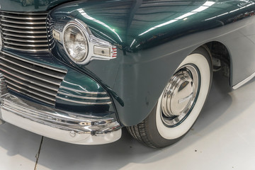 chrome plated front bumper and light of vintage car, Wanaka, New Zealand