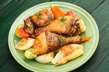 Grilled chicken leg with boiled potatoes and vegetable