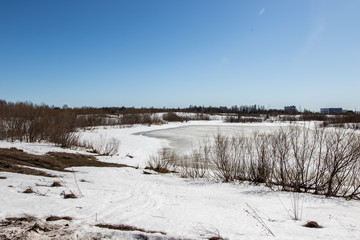 Fototapeta na wymiar Winter rural river snowy landscape. Forest river in winter snow.