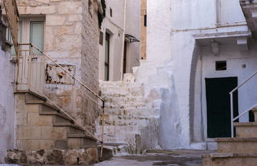 Fototapeta na wymiar Old narrow town street in historic center of Ostuni, Italy