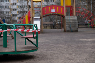Playground covered with red-white ribbon.