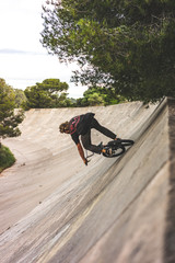 riding a bmx bike at a race track