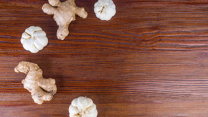 ginger and garlic on wooden background