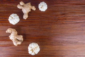 ginger and garlic on wooden background