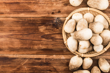 straw mushroom group on wooden background with