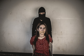 Asian hostage woman Bound with rope at night scene,The thieves kidnapped for ransom,thailand people
