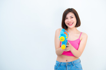 Asian sexy woman with gun water in hand on white background,Festival songkran day at thailand,The best of festival of thai,Land of smile