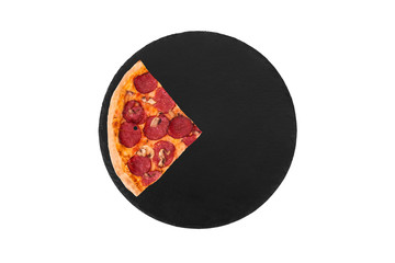 A slice of salami pizza with mushrooms, on slate bottom top view, isolated on white