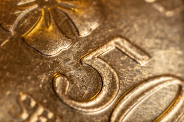 macro photography of 50 Malaysian ringgit cent. The bank negara fifty cent coin of Malaysia. Sharp detailed capture of the Malaysia character on the RM 50 sen coin. microscopic picture of this coin © Holger