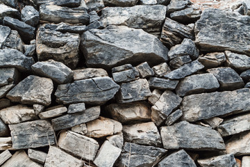Close-up texture. Wall lined with stones.