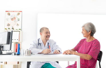 Fototapeta premium close up old asian woman, Asian doctor talk with old female patient about disease symptom, elderly health check up, happiness hospital
