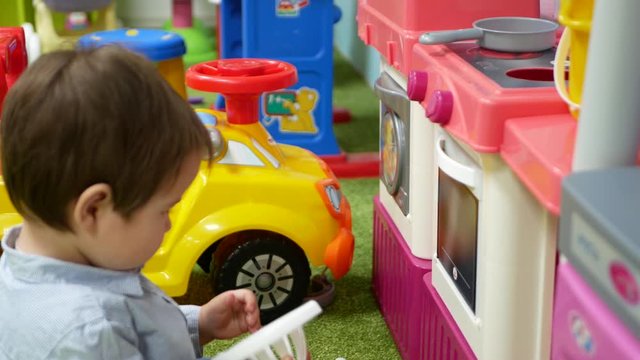 The child plays in the center of development. 0-1 year