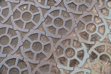Background image of a road made of metal gears