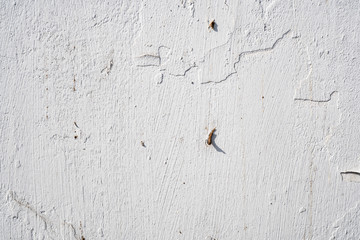 Background image of texture of painted concrete wall in cracks