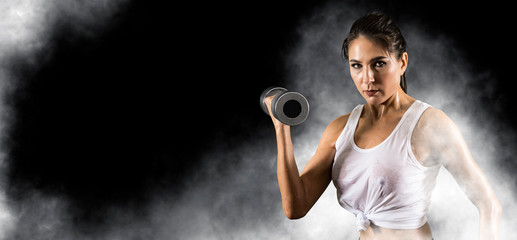 Woman working out with dumbbell