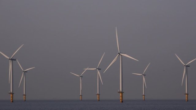 Offshore wind turbine farm off teesside North east England UK 4K