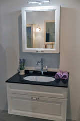 Rectangular mirror on the wall in bathroom