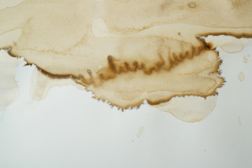 brown stained paint grunge stain spilled onto paper