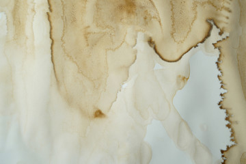 brown stained paint grunge stain spilled onto paper