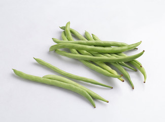 Bunch of green wax beans isolated on white